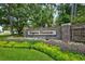 Welcoming entrance to Kingston Plantation showcasing colorful flowers and manicured greenery at 201 Westleton Dr. # 10-I, Myrtle Beach, SC 29572