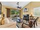 Cozy living room featuring a fireplace and access to an outdoor deck at 201 Westleton Dr. # 10-I, Myrtle Beach, SC 29572