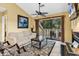Bright living room with sliding glass doors and comfortable seating at 201 Westleton Dr. # 10-I, Myrtle Beach, SC 29572