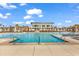 Expansive swimming pool with clear water, surrounded by palm trees and lounge chairs at 201 Westleton Dr. # 10-I, Myrtle Beach, SC 29572