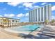 Luxurious pool area featuring a large pool, sun loungers, and a tall hotel at 201 Westleton Dr. # 10-I, Myrtle Beach, SC 29572