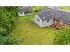 Lush backyard featuring a detached garage and patio, offering a private outdoor space at 203 Longwood Ln., Conway, SC 29527