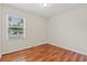 Bedroom featuring wood flooring, a window providing natural light, and neutral walls for any decor style at 203 Longwood Ln., Conway, SC 29527