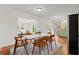 Open concept dining room with wood floors and modern furnishings at 203 Longwood Ln., Conway, SC 29527