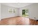 Bright living room with sliding glass doors leading to the backyard at 203 Longwood Ln., Conway, SC 29527