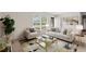 Staged living room with neutral palette, plush seating, and glass coffee table at 203 Longwood Ln., Conway, SC 29527