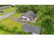 Aerial view showcasing a home's backyard with a detached garage, carport, and verdant surroundings at 203 Longwood Ln., Conway, SC 29527