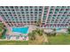 Aerial view of resort featuring a pool, palm trees, and a courtyard at 2207 S Ocean Blvd. # 1517, Myrtle Beach, SC 29577