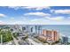 Aerial view of a coastal city featuring resorts, palm trees, and the ocean at 2207 S Ocean Blvd. # 1517, Myrtle Beach, SC 29577