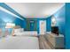 Sunny bedroom featuring two double beds, a TV and bright blue walls at 2207 S Ocean Blvd. # 1517, Myrtle Beach, SC 29577
