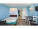 This cozy bedroom features tile floors, seating, and an adjoining space at 2207 S Ocean Blvd. # 1517, Myrtle Beach, SC 29577