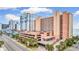 Multi-story condo building exterior shows beautiful parking and lush landscaping at 2207 S Ocean Blvd. # 1517, Myrtle Beach, SC 29577