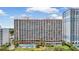 Exterior shot of a beachfront resort with balconies, a pool, and landscaped grounds at 2207 S Ocean Blvd. # 1517, Myrtle Beach, SC 29577