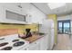 A kitchenette with microwave, coffeemaker, sink, cabinets, and refrigerator at 2207 S Ocean Blvd. # 1517, Myrtle Beach, SC 29577