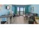 Living room features seating, a table, and access to a balcony with ocean views at 2207 S Ocean Blvd. # 1517, Myrtle Beach, SC 29577