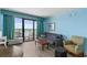 Living room features seating, a table, and access to a balcony with ocean views at 2207 S Ocean Blvd. # 1517, Myrtle Beach, SC 29577