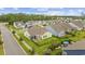 Aerial view showcasing the home's backyard, screened patio, and outdoor grill in a well-maintained community at 2300 Lark Sparrow St., Myrtle Beach, SC 29577