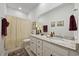 Well-lit bathroom with granite countertops, vanity, and a neutral patterned shower curtain at 2300 Lark Sparrow St., Myrtle Beach, SC 29577
