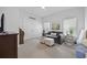 Cozy bedroom with large windows, comfortable seating, and double door closet at 2300 Lark Sparrow St., Myrtle Beach, SC 29577