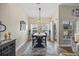 Dining room features modern chandelier and adjacent sliding door to patio at 2300 Lark Sparrow St., Myrtle Beach, SC 29577