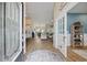 Inviting foyer featuring wood floors, decorative rug, and views of the living spaces at 2300 Lark Sparrow St., Myrtle Beach, SC 29577