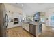 Spacious kitchen island features stainless steel dishwasher and sink, with adjacent breakfast bar seating at 2300 Lark Sparrow St., Myrtle Beach, SC 29577