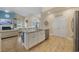 Kitchen island boasts stainless dishwasher and sink, with seating open to living room at 2300 Lark Sparrow St., Myrtle Beach, SC 29577