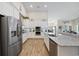 Open kitchen with stainless steel appliances, granite counters, and modern finishes at 2300 Lark Sparrow St., Myrtle Beach, SC 29577