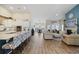 Open concept living room showcasing hardwood floors, modern fireplace, and elegant furnishings at 2300 Lark Sparrow St., Myrtle Beach, SC 29577
