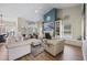 Bright living room featuring a fireplace, vaulted ceiling, and views of the windows at 2300 Lark Sparrow St., Myrtle Beach, SC 29577