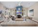 Elegant living room with vaulted ceilings, fireplace, and plush seating at 2300 Lark Sparrow St., Myrtle Beach, SC 29577
