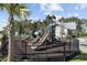 Community playground with slides, climbing structures, and a secure fence for enjoyment and safety at 2300 Lark Sparrow St., Myrtle Beach, SC 29577