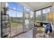 Bright sun room featuring large windows, comfortable seating, and views of the pool at 2300 Lark Sparrow St., Myrtle Beach, SC 29577