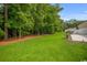 Enjoy the serenity of this spacious backyard, featuring lush greenery and mature trees for added privacy and shade at 231 Marbella Dr., Murrells Inlet, SC 29576