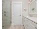 Contemporary bathroom featuring a glass-enclosed shower and a double vanity at 231 Marbella Dr., Murrells Inlet, SC 29576