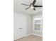 Neutral bedroom features a closet with white doors and a bright window for natural light at 231 Marbella Dr., Murrells Inlet, SC 29576
