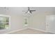 Bright bedroom with a ceiling fan and large windows and a door to the bathroom at 231 Marbella Dr., Murrells Inlet, SC 29576