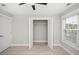 Bright bedroom with a window and a closet with the doors open revealing wire shelving at 231 Marbella Dr., Murrells Inlet, SC 29576