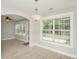 Inviting dining room with an archway, a decorative light fixture, and lots of windows at 231 Marbella Dr., Murrells Inlet, SC 29576