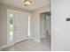 Inviting entryway featuring neutral walls, decorative light fixtures, and tile flooring at 231 Marbella Dr., Murrells Inlet, SC 29576