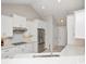 Bright kitchen featuring white cabinets, stainless steel appliances, and stone countertops at 231 Marbella Dr., Murrells Inlet, SC 29576