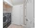 Modern laundry room with black washer and dryer at 231 Marbella Dr., Murrells Inlet, SC 29576