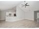 Open-concept living area with tile floors, white cabinets, and stainless steel appliances at 231 Marbella Dr., Murrells Inlet, SC 29576