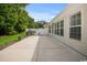 The expansive concrete patio is perfect for outdoor relaxation and entertaining, with ample space for seating and grilling at 231 Marbella Dr., Murrells Inlet, SC 29576