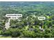 Aerial shot of the property, showcasing the house and a nearby boat ramp surrounded by lush greenery at 2382 Waverly Rd., Pawleys Island, SC 29585