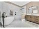 Luxurious bathroom with a soaking tub, walk-in shower, and stylish vanity at 2382 Waverly Rd., Pawleys Island, SC 29585