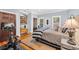 Cozy bedroom featuring hardwood floors, natural light, and a dedicated workout area with a stationary bike at 2382 Waverly Rd., Pawleys Island, SC 29585