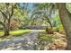 Beautiful home surrounded by mature trees, a long driveway, and lush landscaping offers a serene setting at 2382 Waverly Rd., Pawleys Island, SC 29585