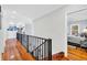 Upstairs hallway with hardwood floors leading to a bedroom at 2382 Waverly Rd., Pawleys Island, SC 29585
