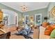 Inviting living room with windows, comfortable seating, and a warm ambiance perfect for relaxing and entertaining at 2382 Waverly Rd., Pawleys Island, SC 29585